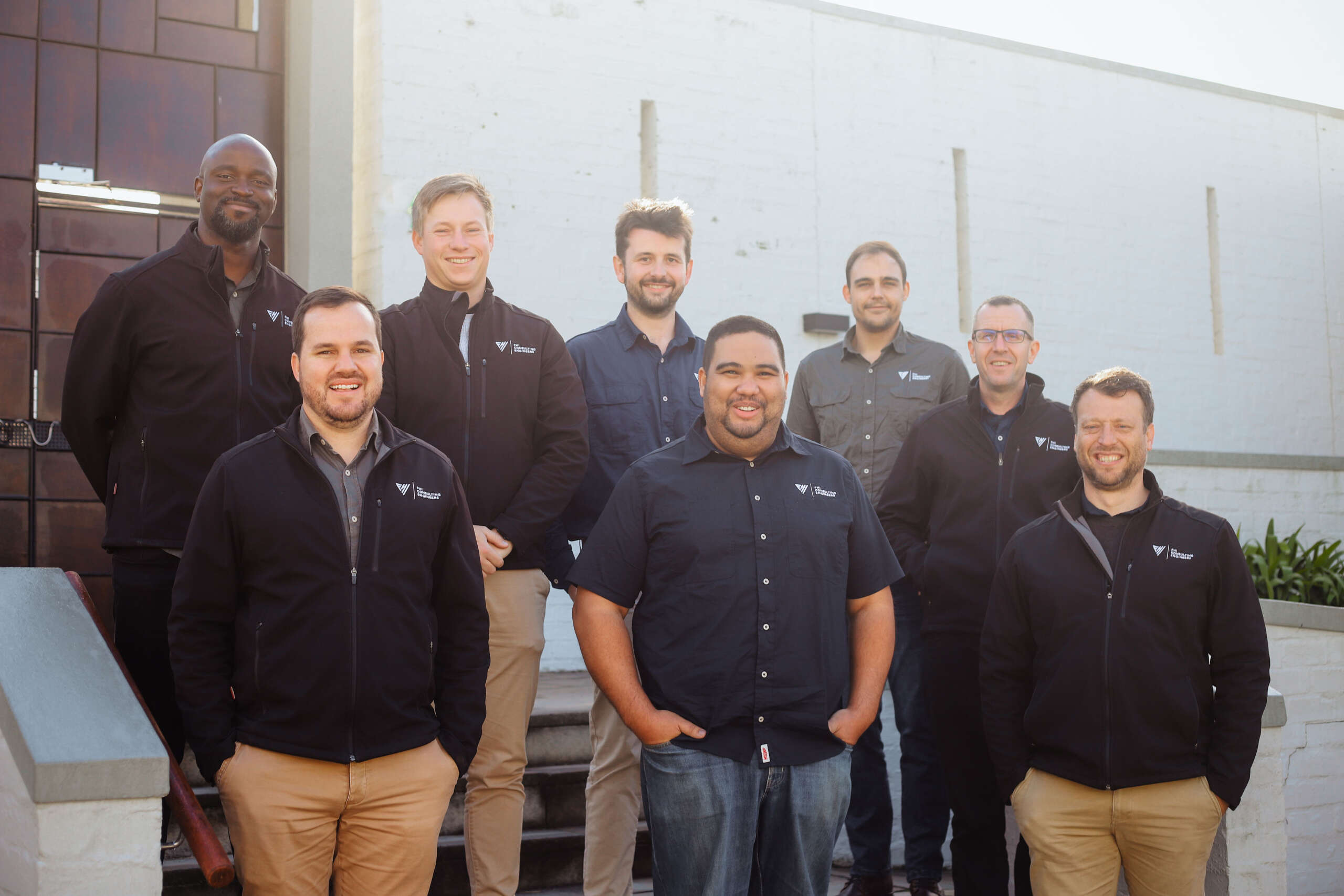 FHI Consulting Engineers team standing together outside
